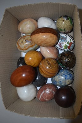 Lot 78 - Boxed lot of carved stone and wooden painted eggs