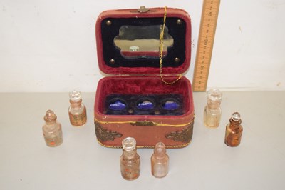 Lot 100 - A small case of perfume bottles