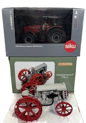 Lot 209 - A pair of boxed die-cast agricultural vehicles,...