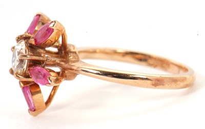 Lot 25 - A pink sapphire and CZ ring, the central round...