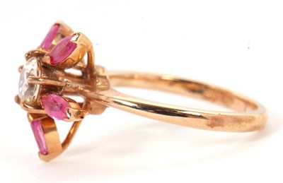 Lot 25 - A pink sapphire and CZ ring, the central round...