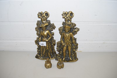 Lot 165 - TWO SMALL CAST BRASS DOOR STOPS FORMED AS A...