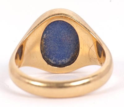 Lot 13 - An 18ct signet ring, set with an oval blue...