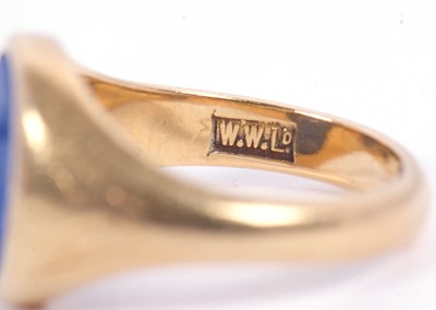 Lot 13 - An 18ct signet ring, set with an oval blue...