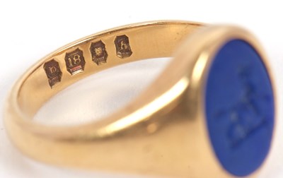 Lot 13 - An 18ct signet ring, set with an oval blue...