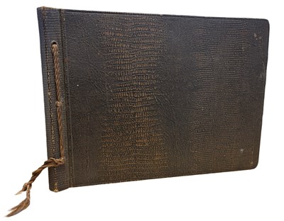 Lot 1100 - An early 20th century photograph album,...