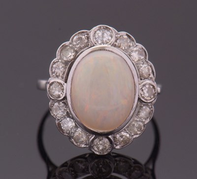 Lot 265 - An opal and diamond ring, the oval opal...