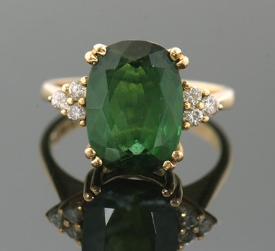 Lot 277 - An 18ct green tourmaline and diamond ring, the...