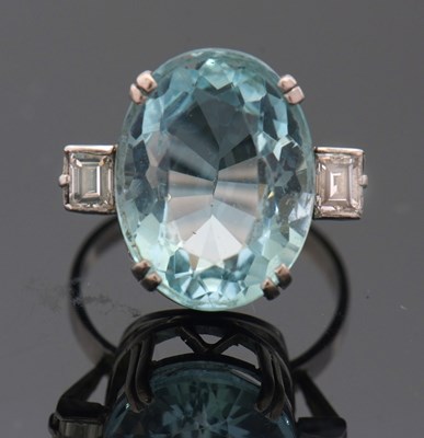 Lot 271 - An aquamarine and diamond ring, the oval...
