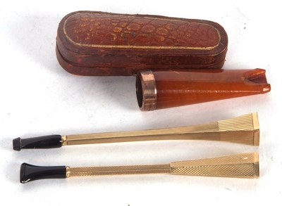 Lot 160 - Two 9ct gold cigarette holders both with...
