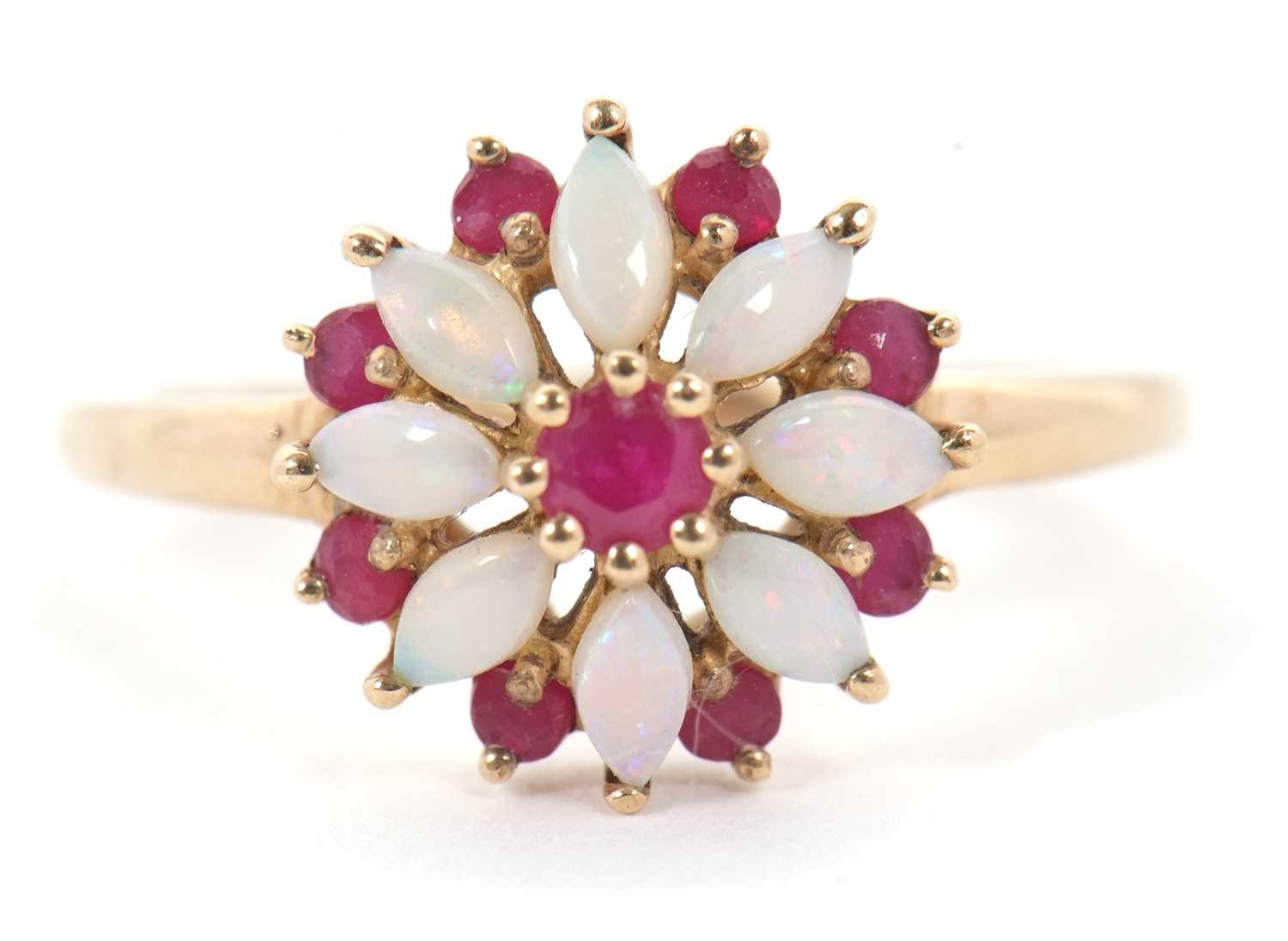 Lot 43 - A 9ct ruby and opal ring, set with a central...