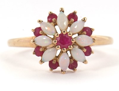 Lot 43 - A 9ct ruby and opal ring, set with a central...