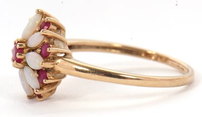 Lot 43 - A 9ct ruby and opal ring, set with a central...