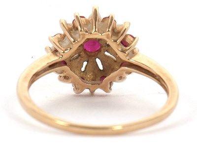 Lot 43 - A 9ct ruby and opal ring, set with a central...