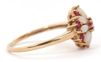 Lot 43 - A 9ct ruby and opal ring, set with a central...