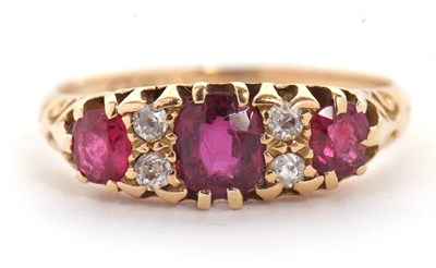 Lot 48 - An 18ct garnet and diamond ring, the three...