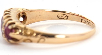 Lot 48 - An 18ct garnet and diamond ring, the three...