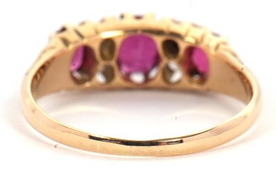 Lot 48 - An 18ct garnet and diamond ring, the three...