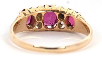 Lot 48 - An 18ct garnet and diamond ring, the three...