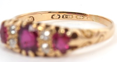 Lot 48 - An 18ct garnet and diamond ring, the three...