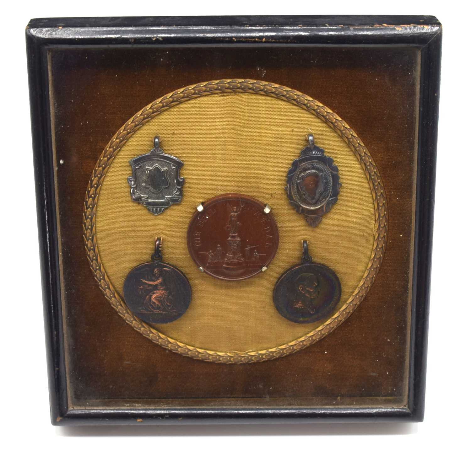 Lot 10 - Small framed display of miniatue shooting club...