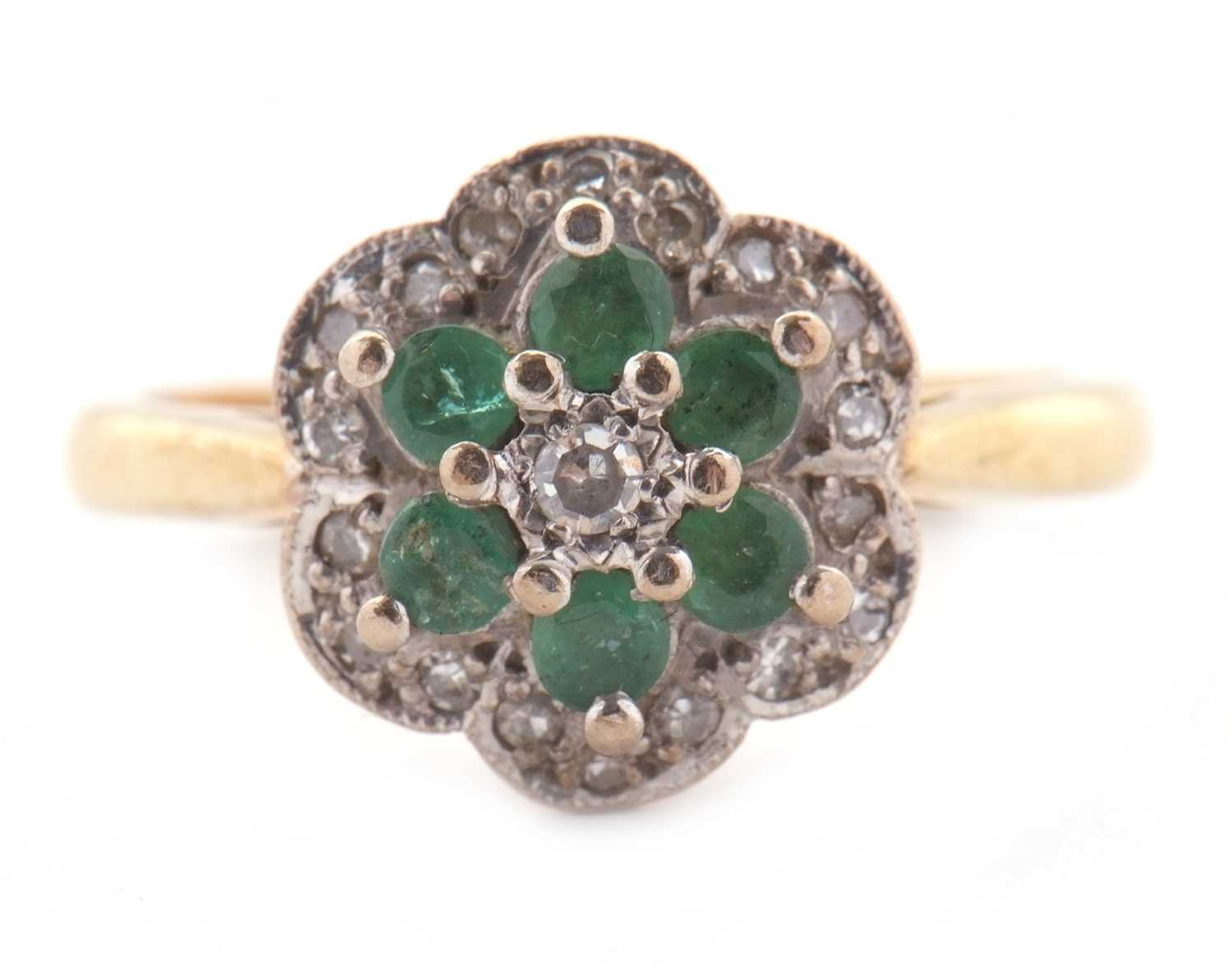 Lot 70 - An 18ct emerald and diamond cluster ring,...