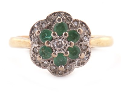 Lot 70 - An 18ct emerald and diamond cluster ring,...