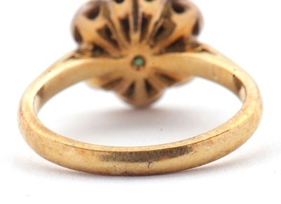 Lot 70 - An 18ct emerald and diamond cluster ring,...