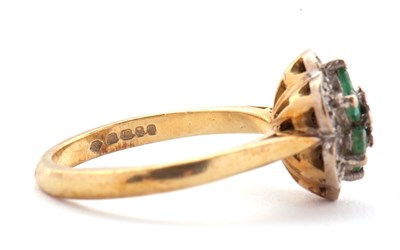 Lot 70 - An 18ct emerald and diamond cluster ring,...