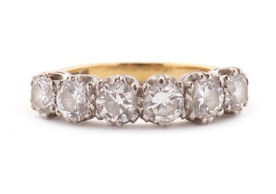 Lot 79 - An 18ct six stone diamond ring, the six round...