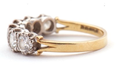 Lot 79 - An 18ct six stone diamond ring, the six round...