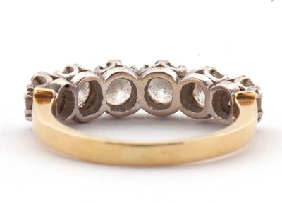 Lot 79 - An 18ct six stone diamond ring, the six round...