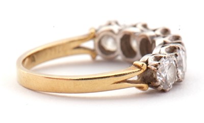 Lot 79 - An 18ct six stone diamond ring, the six round...