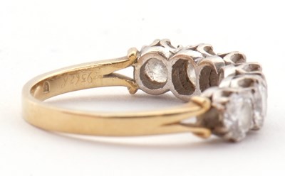 Lot 79 - An 18ct six stone diamond ring, the six round...
