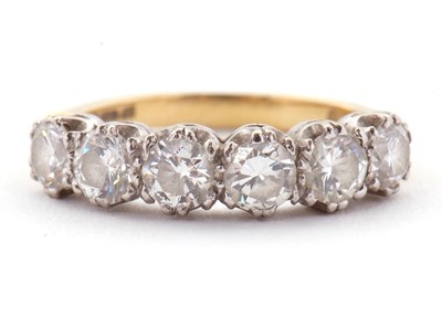 Lot 79 - An 18ct six stone diamond ring, the six round...