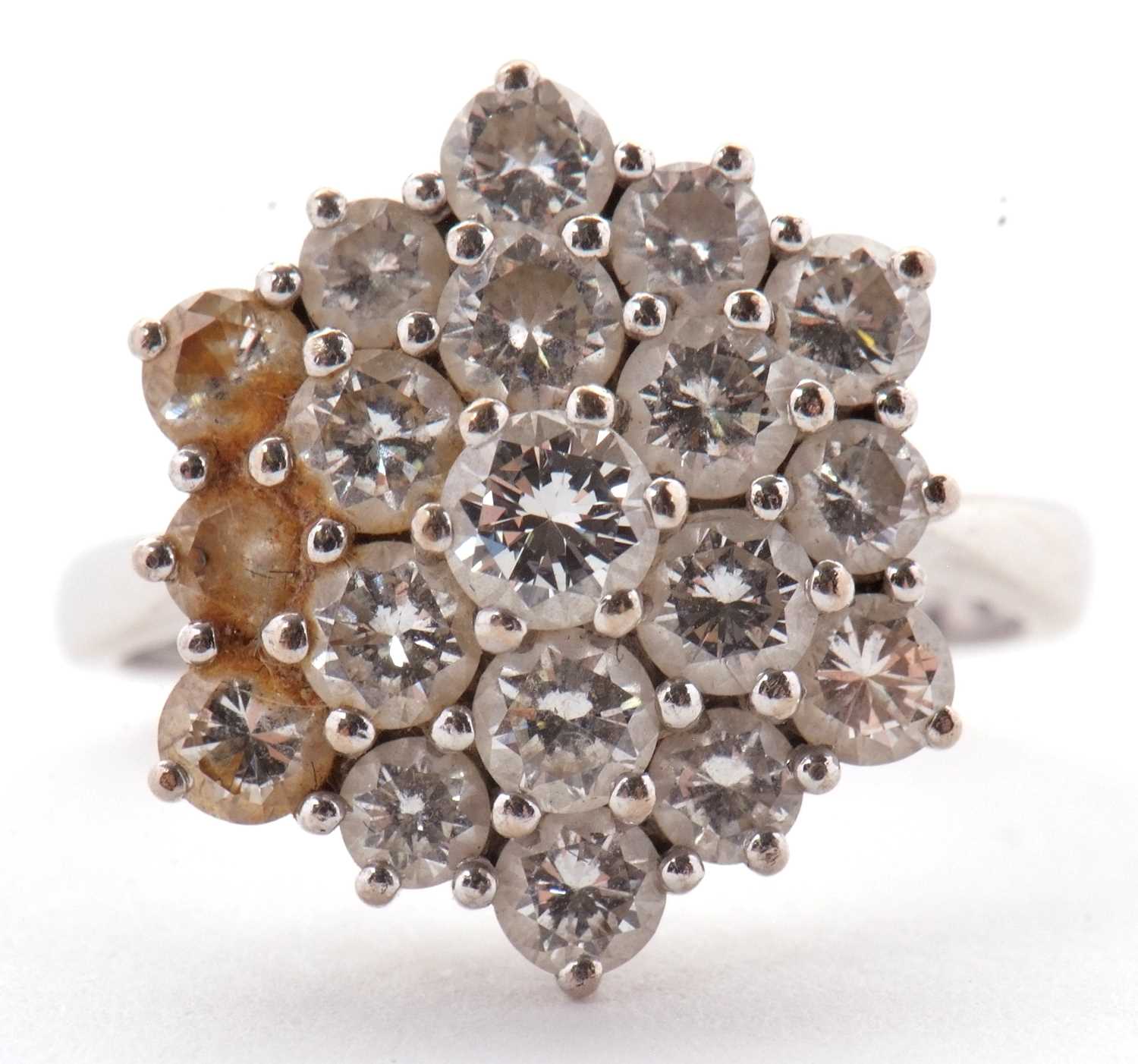 Lot 85 - An 18ct diamond cluster ring, set with round...