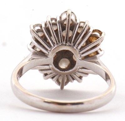Lot 85 - An 18ct diamond cluster ring, set with round...