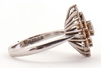 Lot 85 - An 18ct diamond cluster ring, set with round...