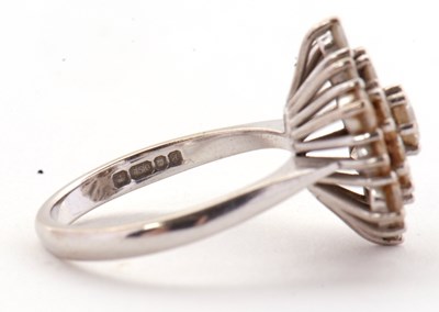Lot 85 - An 18ct diamond cluster ring, set with round...