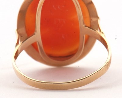 Lot 19 - A cameo ring, the oval shell cameo in collet...