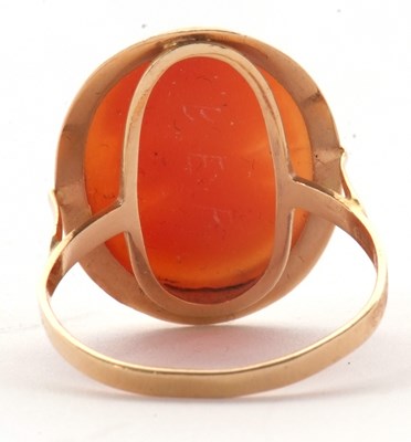 Lot 19 - A cameo ring, the oval shell cameo in collet...