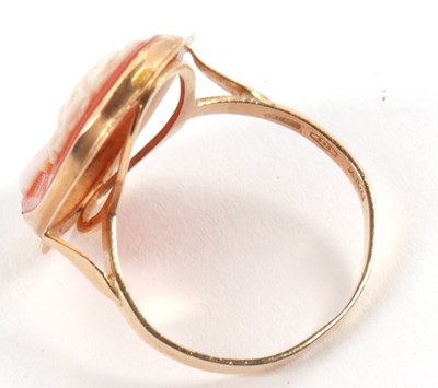 Lot 19 - A cameo ring, the oval shell cameo in collet...
