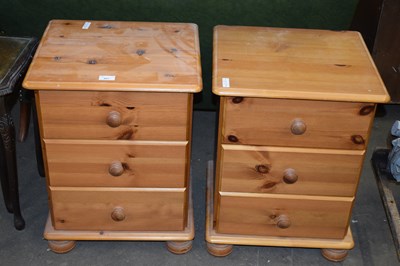 Lot 807 - PAIR OF THREE DRAWER PINE BEDSIDE CABINETS