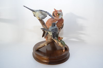 Lot 127 - Large model of an owl on a branch with two birds