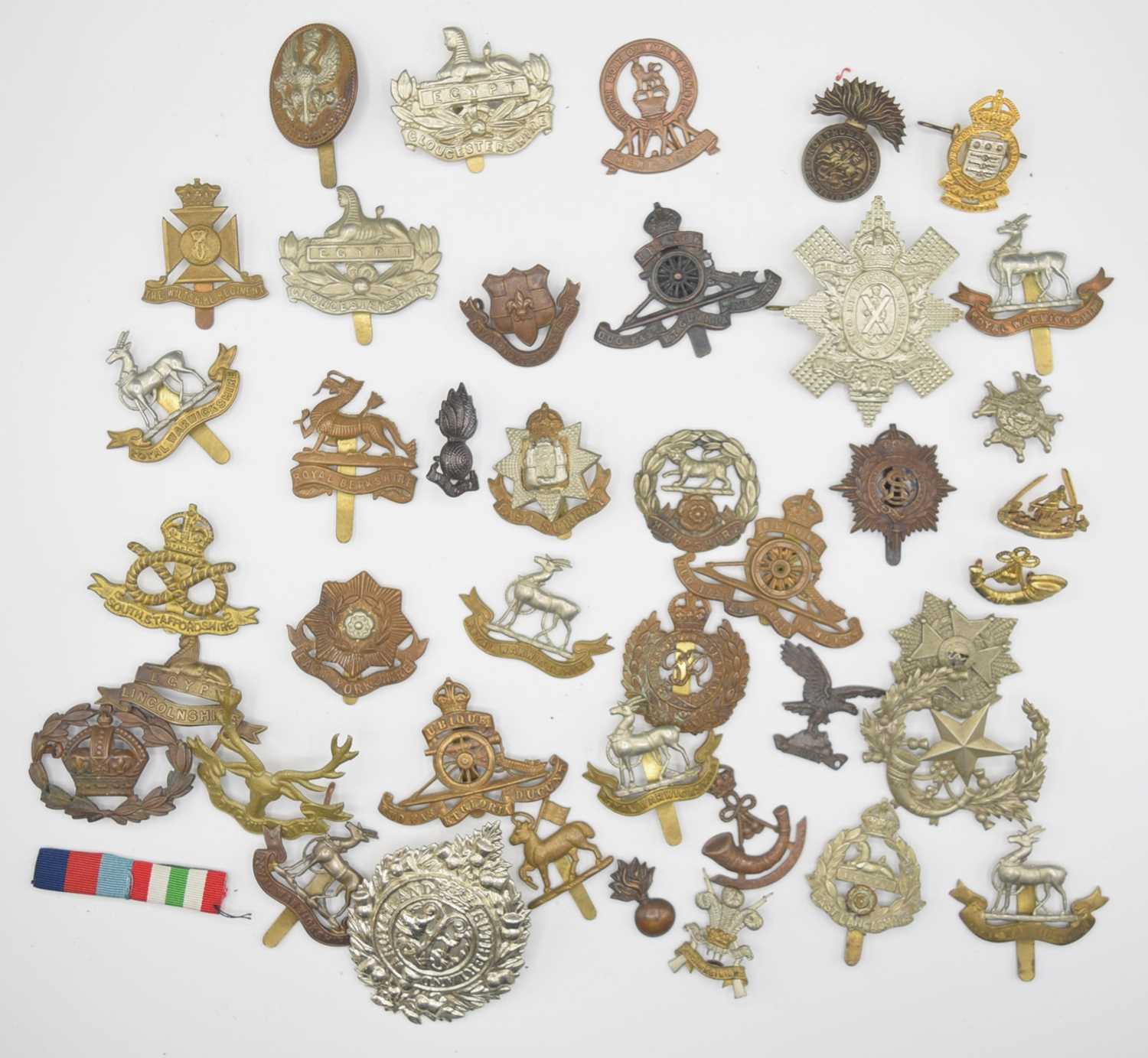 Lot 41 - Quantity of 20th century British army cap...