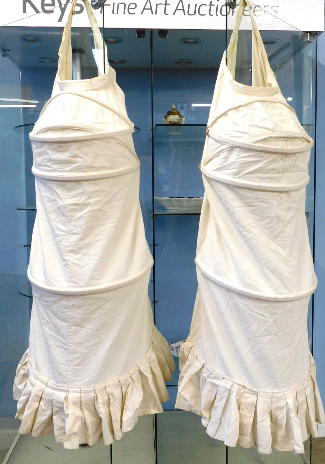 Lot 73 - Two reproduction calico bustle back crinoline...