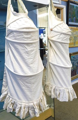 Lot 73 - Two reproduction calico bustle back crinoline...