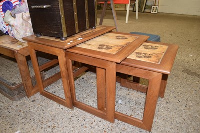 Lot 398 - NEST OF THREE TILE TOP TEAK FRAMED OCCASIONAL...