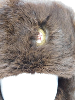 Lot 82 - A fur trapper hat, with Communist badge