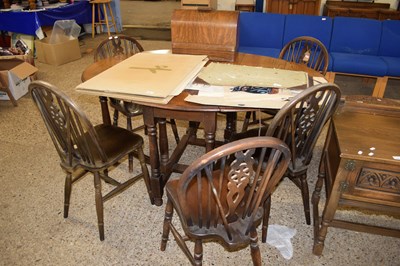 Lot 399 - OVAL OAK DROP LEAF DINING TABLE AND SIX WHEEL...